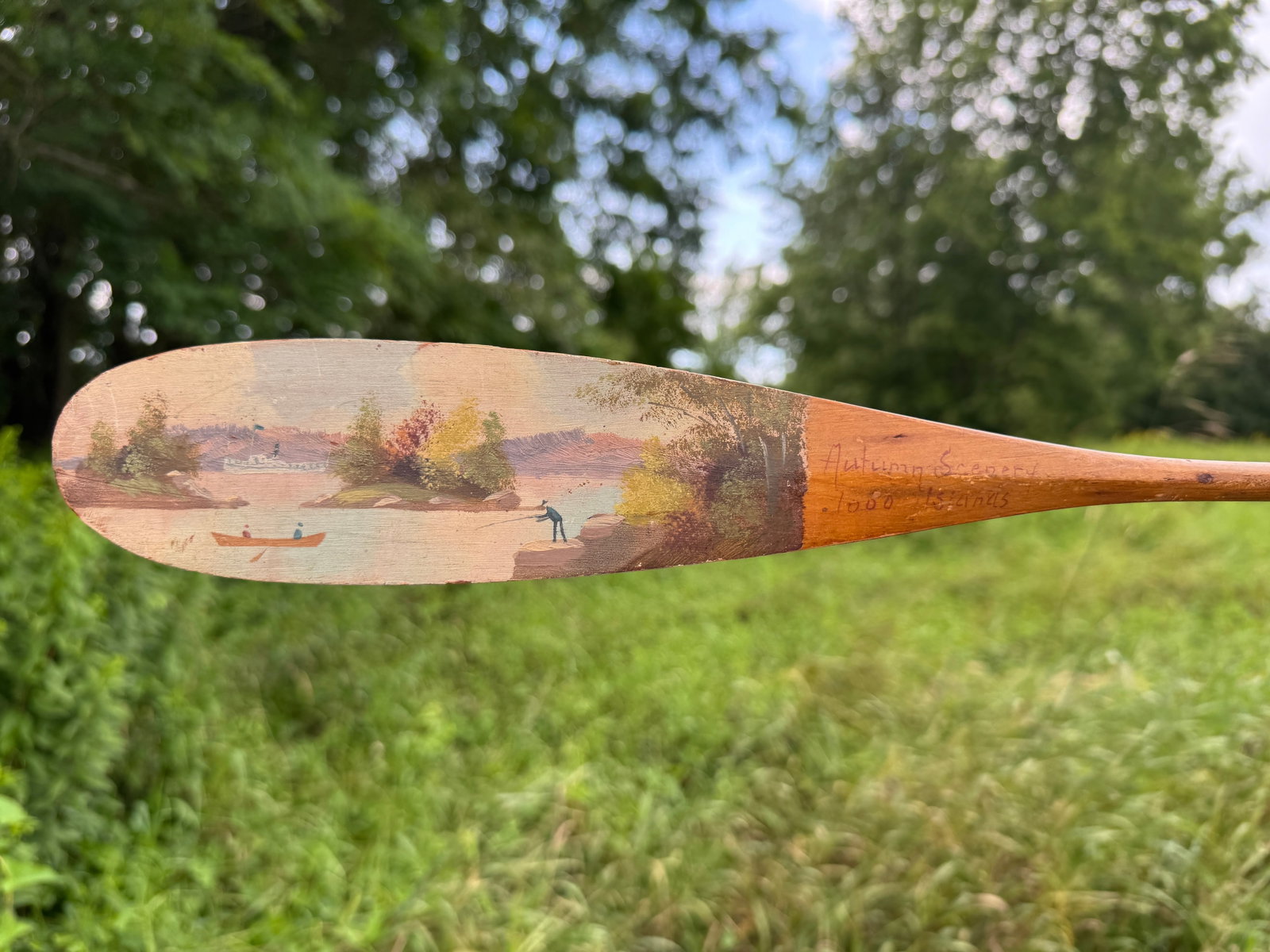 Keech Souvenir Paddle "Autumn Scenery": Thousand Islands with steamboat. Soiled and some wear. 22" long. From the Estate of Dr. Dean Hyde, Clayton, NY.