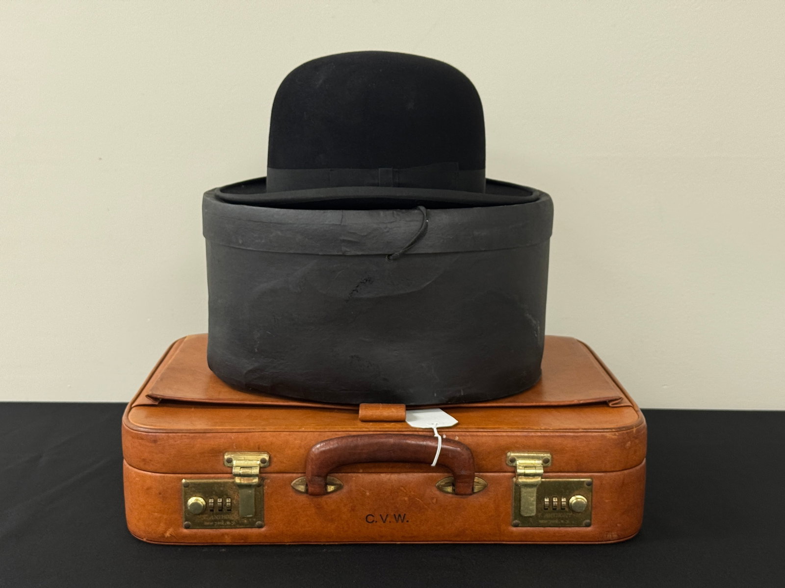C.V. Whitney's Leather Briefcase & Boiler Hat: leather T. Anthony Briefcase monogrammed CVW. Boiler hat with box marked Mr. C.V. Whitney. From Camp Deerlands, Whitney Park.
