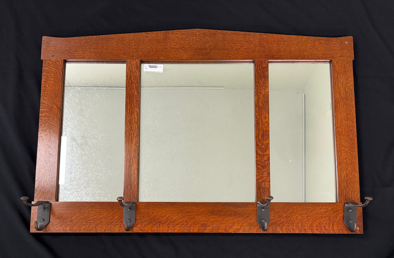 Stickley Hall Mirror with Hat Hooks: #32. Marked 89-66. measures 42.5" wide x 28.25" tall. There is a small hole in each corner where it was previously screwed to the wall.