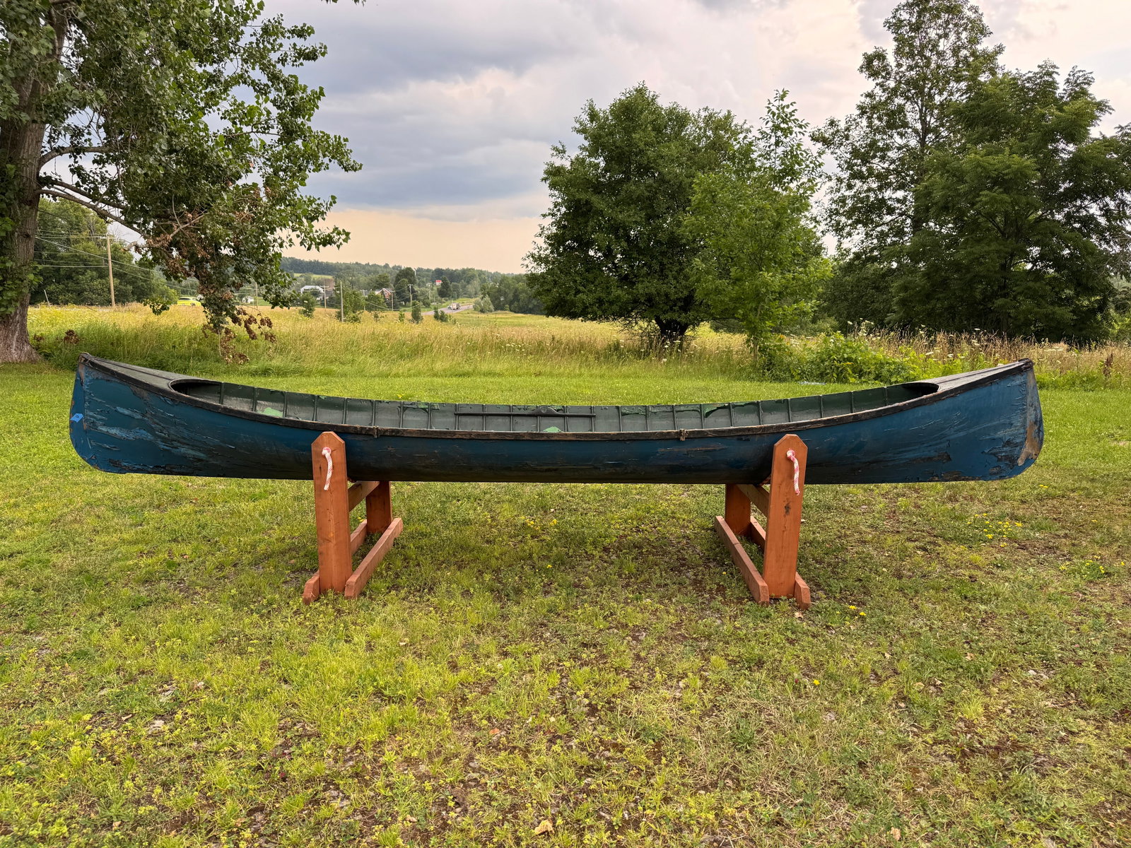 Adirondack Guideboat - 15.5' long: painted blue exterior, green interior. 38" wide, smooth skin, some damage, needs restoration. This boat has been in storage in the carriage barn at Whitney Park for the last 50 years.