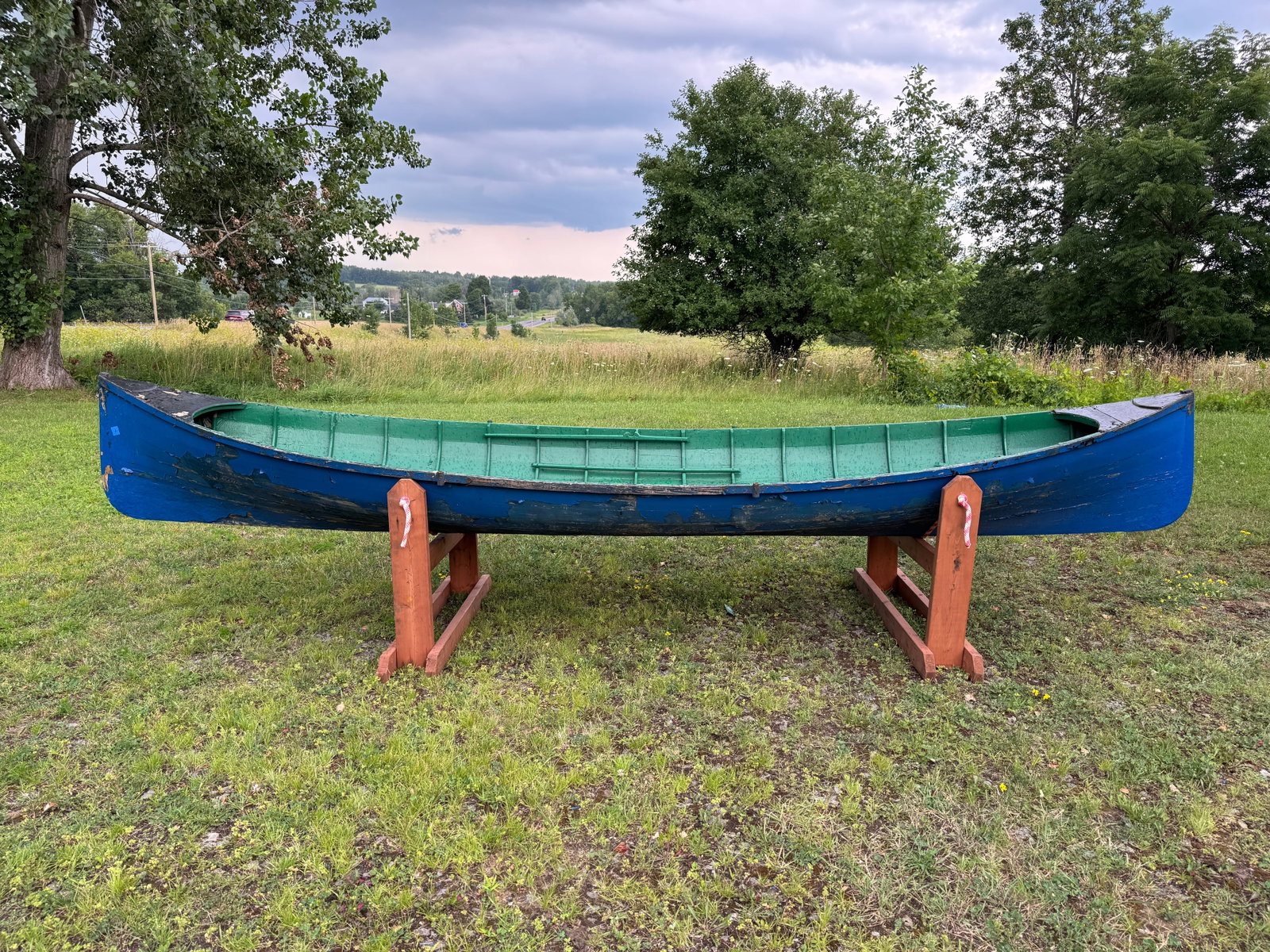 Adirondack Guideboat - 15' long: Painted blue exterior, green interior, 42" wide. Needs restoration. This boat has been in storage in the carriage barn at Whitney Park for the last 50 years.