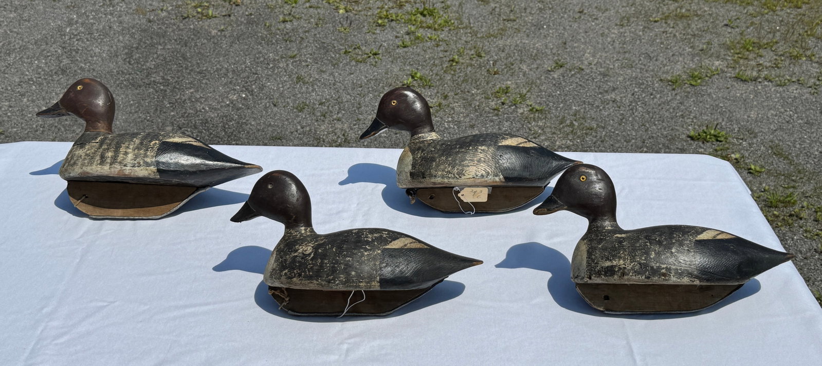 4 Chaucey Patterson Hen Whistler Duck Decoys: Wellesley Island, NY. Early 1900s. From the same rig. All 4 with damaged bills. From the Andrew Schuler Collection.