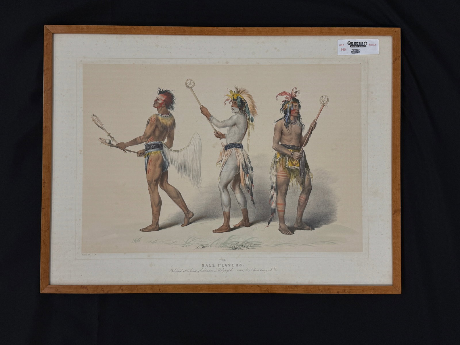 George Catlin (American, 1796-1872) "Ball Players": Hand colored lithograph published by James Ackerman's. Framed and under glass. Appears to have some foxing and needs cleaning on inside of glass. Image size 12" x 17.75" Frame size 17" x 22.75". From