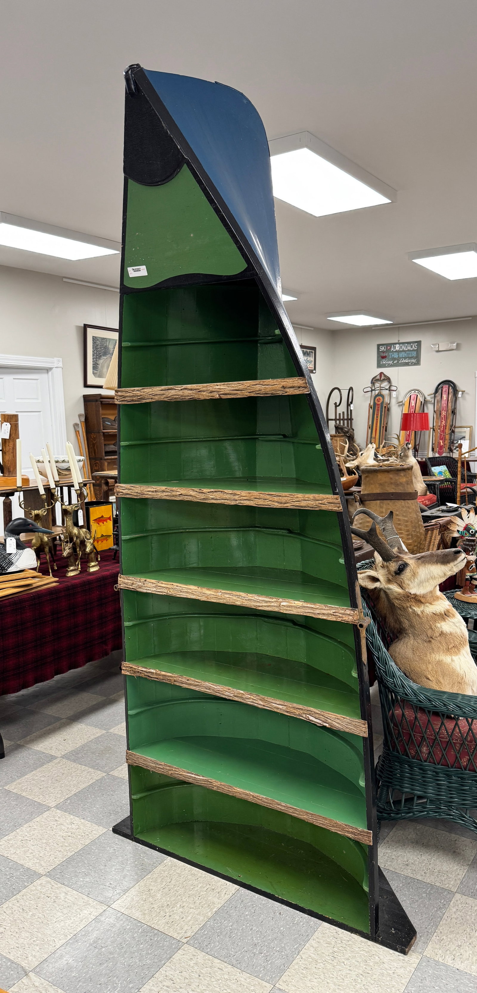 Adirondack Guideboat Display Shelf: with original brass oarlocks. Stands 98" tall and 37" wide. 1890s Adirondack Guideboat once used at Whitney Park. From C.V. Whitney's Fishing Room at Camp Deerlands, Whitney Park.