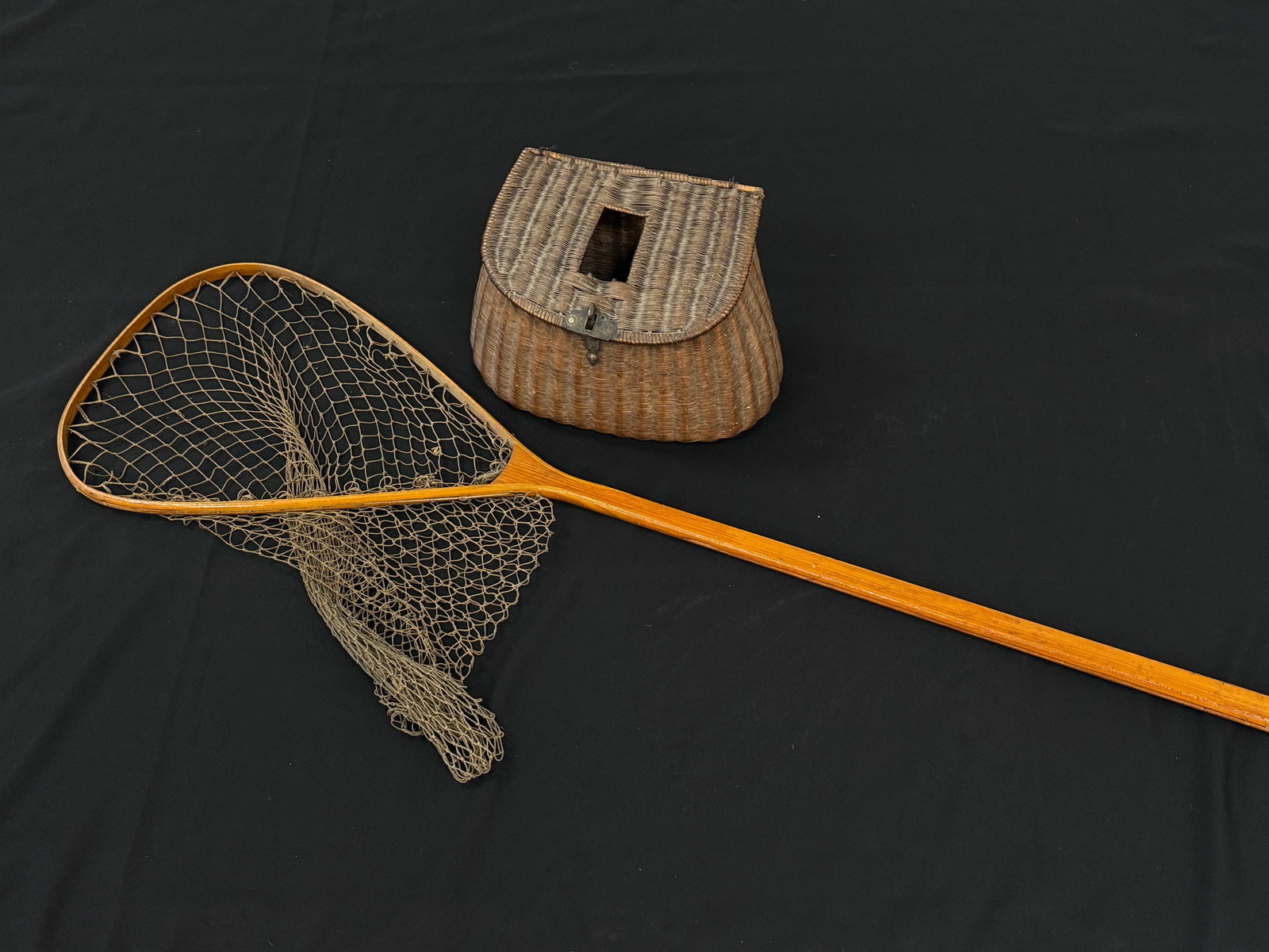 Center Hole Fishing Creel & Boat Net: Creel with a dark patina measures 13" wide. Boat net is 50" long.