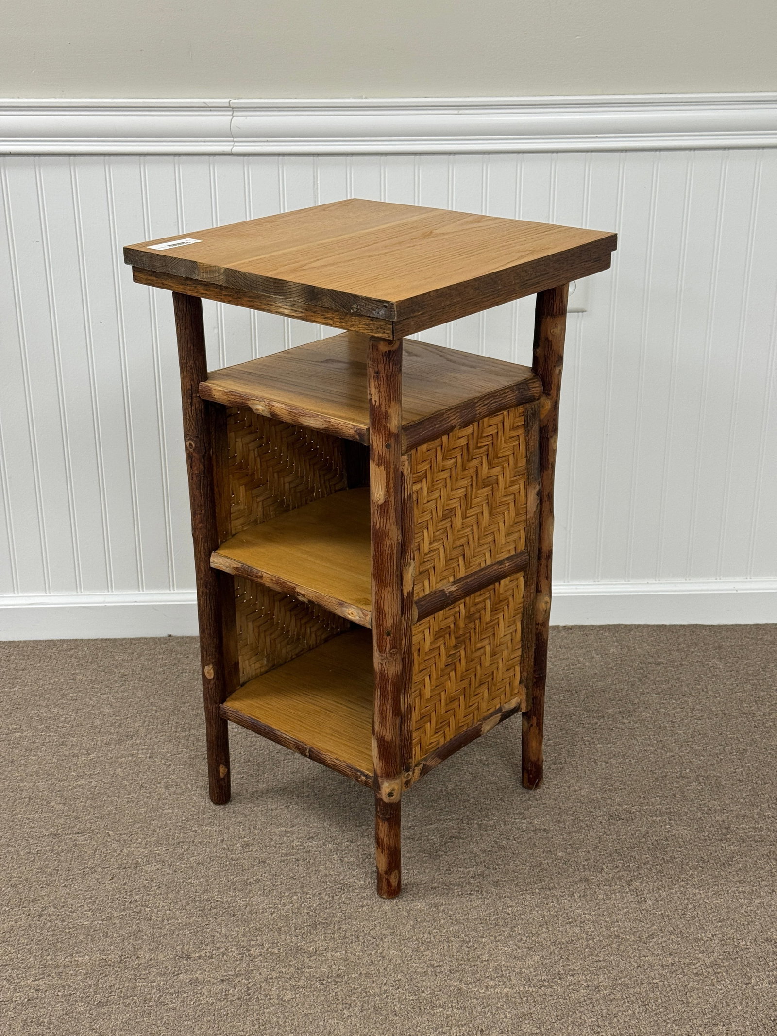 Old Hickory Branded Stand with Woven Sides: Weaving in good condition. From Camp Togus, Whitney Park. 16" x 16" x 30". Magazine Stands No. 239. Circa 1930