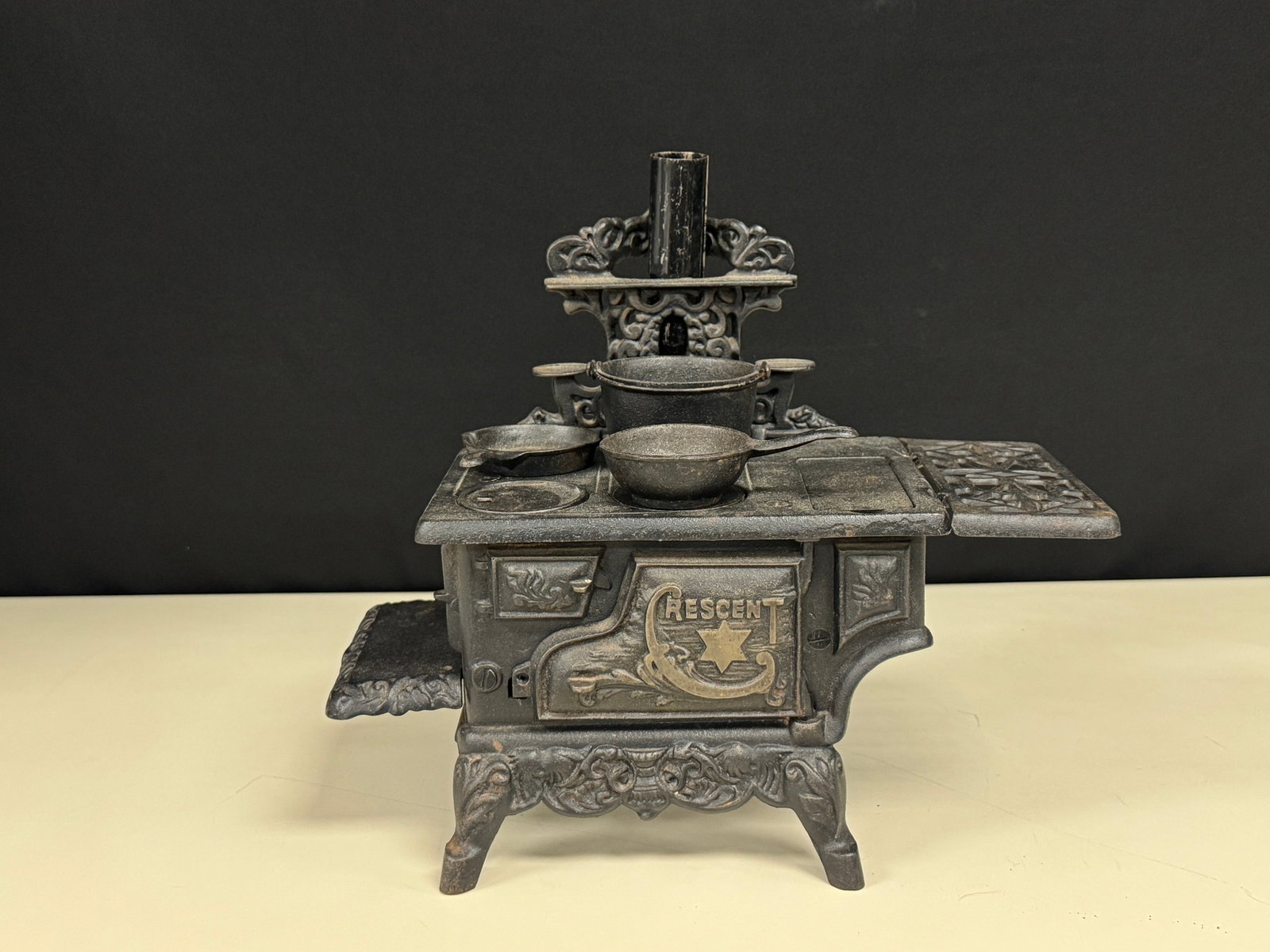 Crescent Cast Iron Toy Cookstove w/ Accessories: 13" long. From Whitney Park.