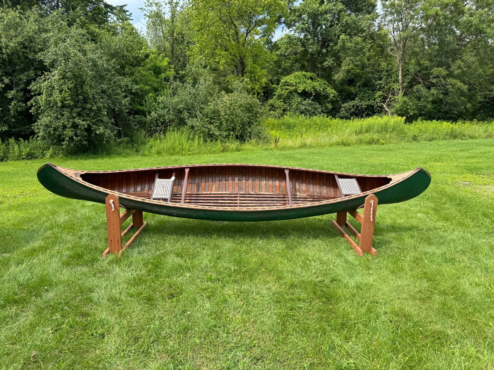 Old Town 16' Wood Canvas Canoe: Serial Number 108162. Natural finish interior, needs a new keel and re-canvasing. From Whitney Park, Adirondacks.