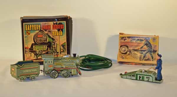 Tin Battery Cable Express Train & Arnold Mechanic: made in G.W. Japan. The toy is complete in very good condition with original box and cable. Arnold tin mechanic with car jack was made in West Germany. Box is in poor condition. It is missing one whee