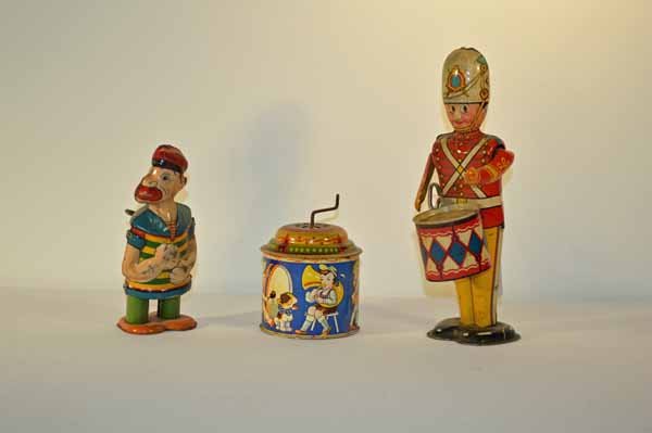 Three Tin Wind-Up Toys: J. Chein Barnacle Bill in working order and in fair condition 6 inches tall. Marx wind up drummer 9 inches tall in working order and in good condition. Tin 3 1/ 2 inch tall wind up noise maker made in