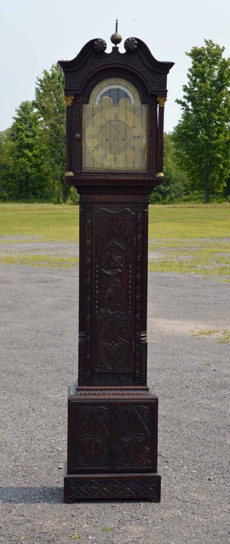 Heavily Carved English Oak Grandfather Clock: Weight Driven - Thomas Sillito Uttoxeter. There is a man with bow and arrow carved on door. 93 inches tall. From a home in the Rochester, NY area