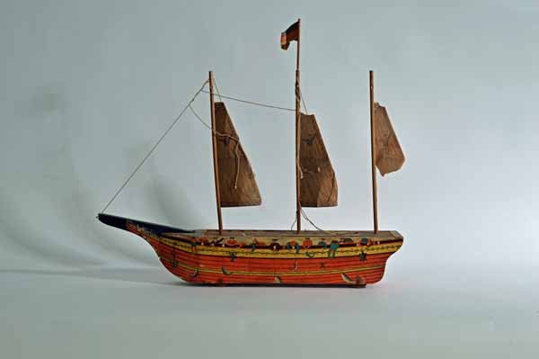 W.S. Reed "The Volunteer" Wooden Toy Boat: 32 inches long. Wooden toy boat with paper graphics.