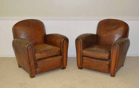 Pair of Leather Club Chairs: Originally purchased in England. Worn leather. Shown in Ralph Kylloe's coffee table book "CABINS" on the front cover and page 110.