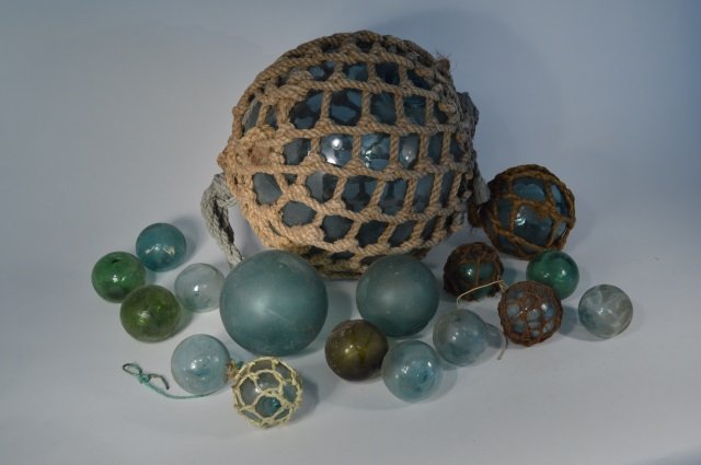 16 Fishing Net Glass Balls: Assorted sizes found washed up on the ocean shore in Alaska. Ranging in size from 3" diameter to 14" diameter.