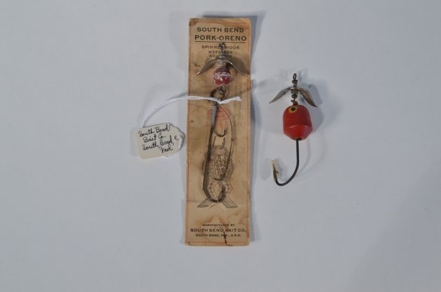 South Bend Pork-Oreno Fishing Lure: Spinning hook, weedless and weighted on original store card along with another South Bend single hook fishing lure. From the Andy Reece Estate, longtime Western NY collector.