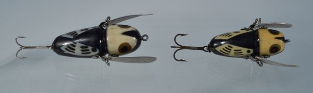 Two Heddon Crazy Crawler Fishing Lures: Black and white, 2 different size variations, both early with two piece hardware. From the Andy Reece Estate, longtime Western NY collector.