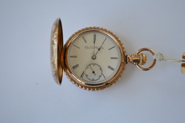 Elgin National Watch Co Pocket Watch: Size 18. Gold engraved pocket watch in a hunter's case.