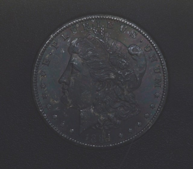 1884-CC US Morgan Silver Dollar (1 of 2)