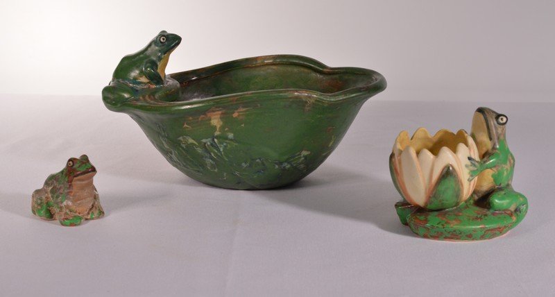 Weller Coppertone Frog Pottery Lot - 4 pieces: The largest piece - The frog has been glued back onto the bowlThe smallest frog looks like it is very dirty from sitting in hard waterThe frog holding the lilly pad looks to be in good condition.