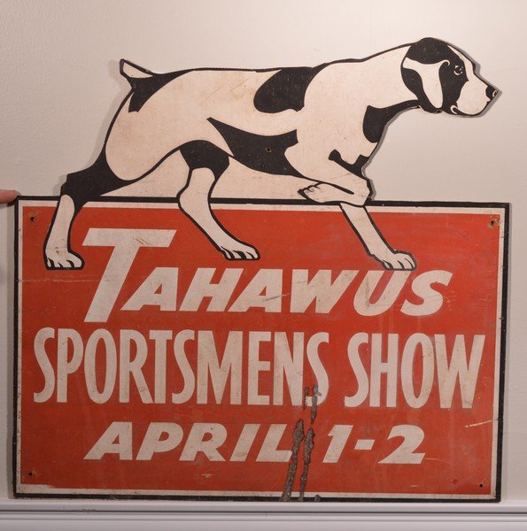 Tahawus Sportsman Show Sign with Dog: The Town of Tahawus was once a mining hamlet in the Town of Newcomb in the Adirondacks. Approx. size 23 1/2" wide x 22 1/4" tall.