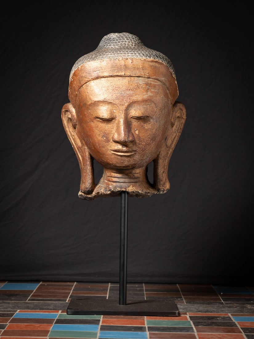 Large antique Stucco Buddha head from Burma (Myanmar), 19th century: This large antique stucco Buddha head, originating from Burma (Myanmar), is a remarkable representation of 19th-century artistry. Standing 104 cm tall, with a stone head measuring 63 cm, it beautifull