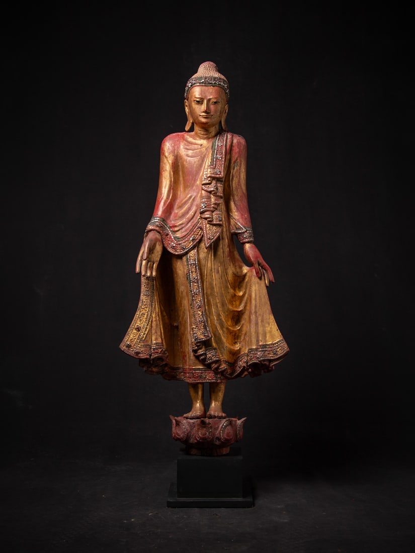 Antique wooden Burmese Mandalay Buddha statue from Burma (Myanmar), 19th century: This exquisite Antique Wooden Burmese Mandalay Buddha statue, standing at 112.5 cm, embodies the artistic craftsmanship of 19th-century Myanmar. Crafted from high-quality wood and gilded with 24 karat