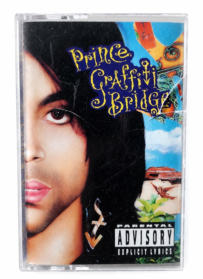 Prince Personally Owned Copy of Graffiti Bridge Cassette: This Cassette Tape of Graffiti Bridge was personally owned by Prince and comes with a Letter of Provenance signed by a Nelson family member. It also comes signed by a reputable online Prince auction h