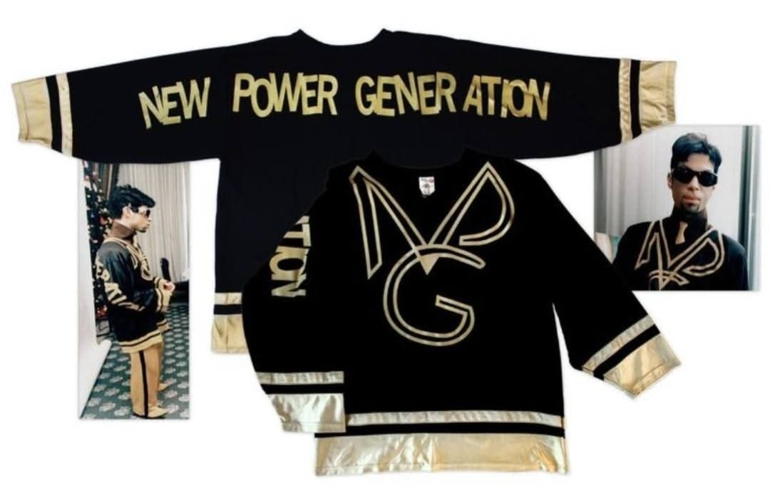 PRINCE Personally Owned and Worn NPG Hockey Jersey: A black and gold size XL hockey Jersey created and worn by Prince during the mid to late 90's. The front of the Jersey has the NPG logo in gold against the balck material with 'New Power Generation' s