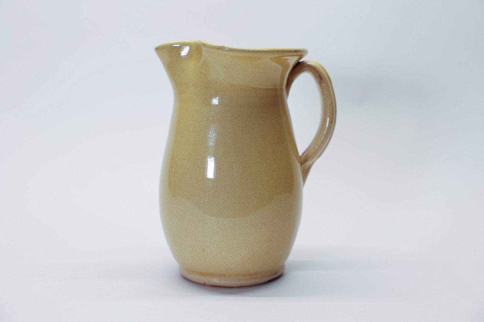 Ceramiche Nicola Fasano Italian Pitcher 8.5": Description:A lovely Italian art pottery pitcher by Ceramiche Nicola Fasano of Grottaglie, Italy, standing 8 1/2 inches tall. The classic bulbous form features a graceful pulled handle and pouring spo