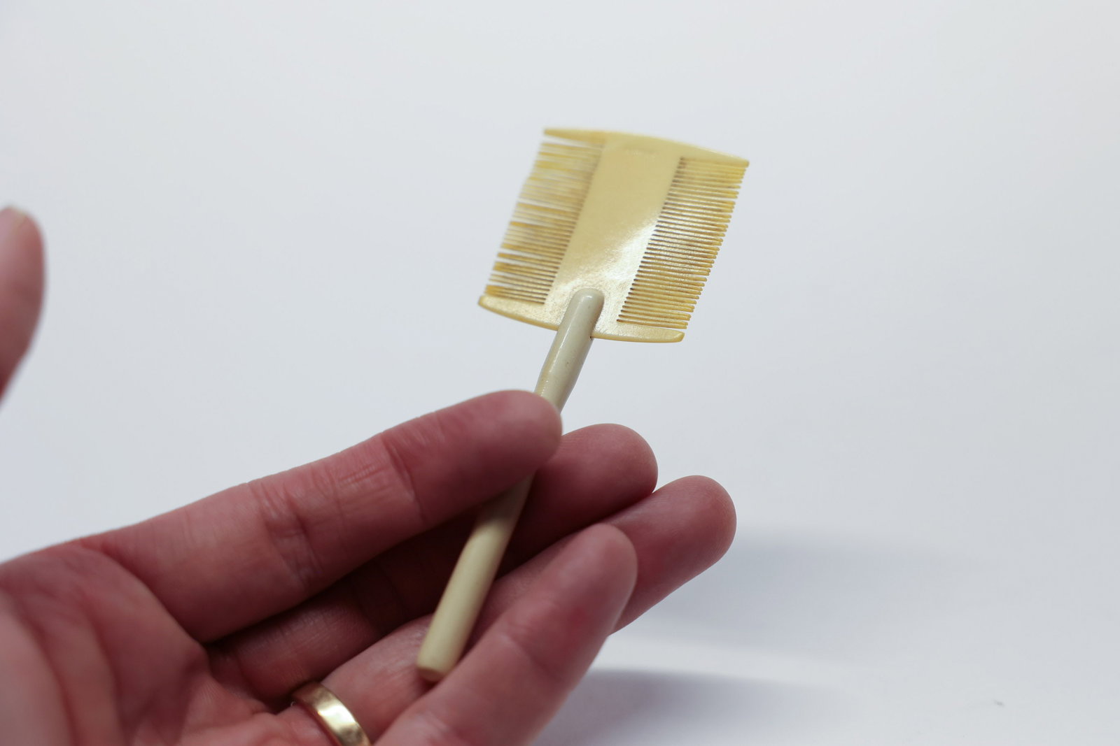 Antique Celluloid Baby Comb/Lice Comb: Germany. 4" 1940s.Dimensions: H: 1.5", W: 0.25", L: 4"