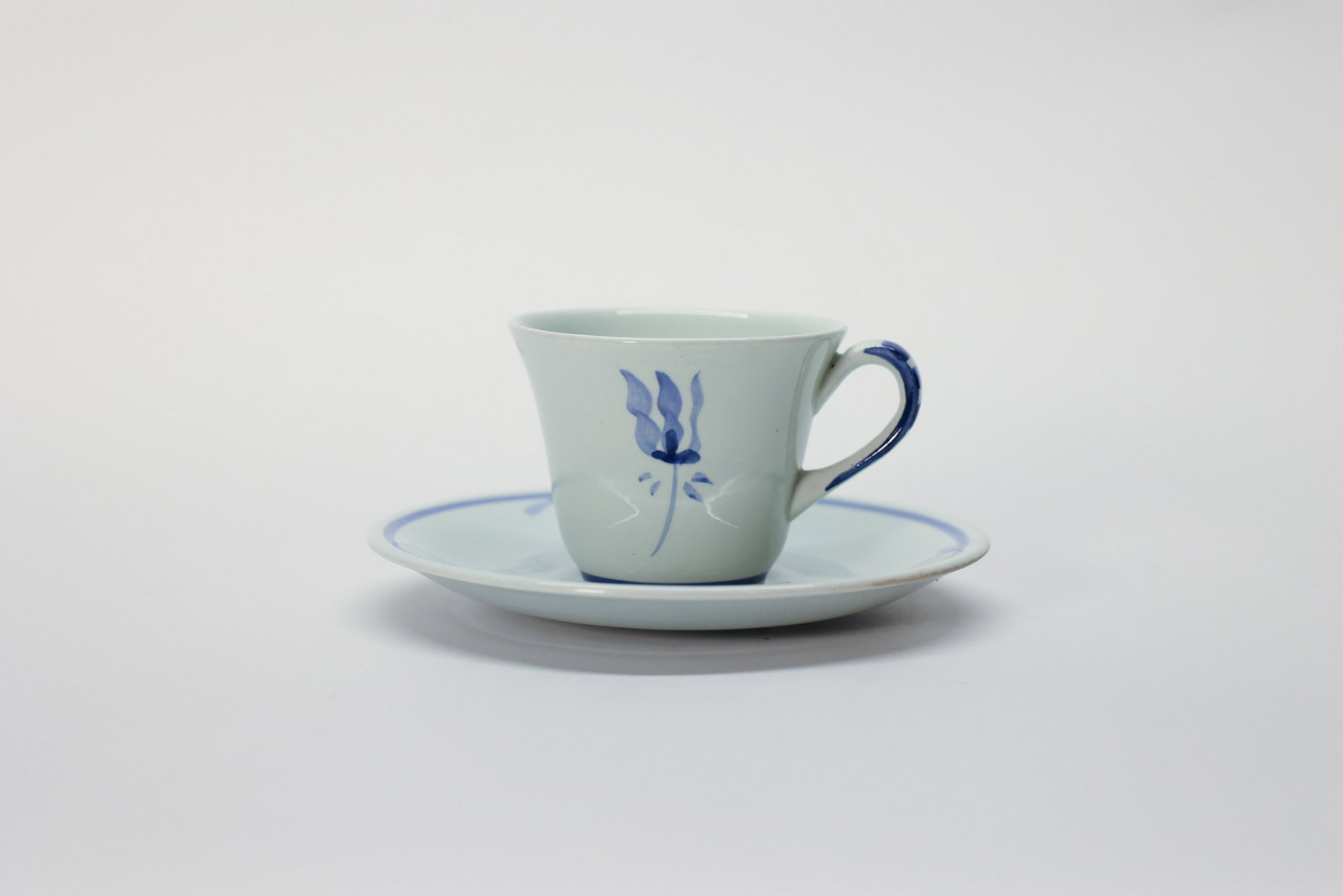 Vintage Teacup and Saucer Set: Royal Goedewaagen Holland Potteries. Delft. Olaf design, handpainted tulip.Dimensions: H: 4", W: 5"