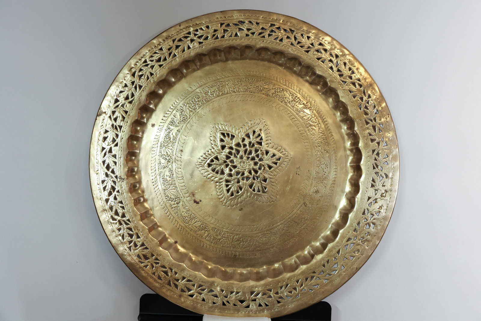 Large Pierced Brass Tray or Table Top: Beautiful vintage piece with some wear. 30 1/2" diameter.Dimensions: H: 1", W: 30.5"