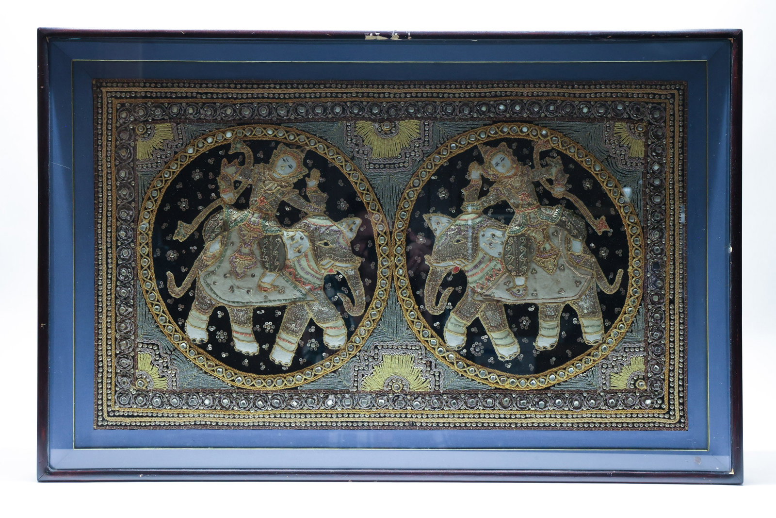Antique Burmese Kalaga Tapestry: Beautiful antique textile featuring elephants, deities and stars. Meticulously and heavily embroidered, mirrored, and sequined. The elephants and deities are appliqued and stuffed creating a 3