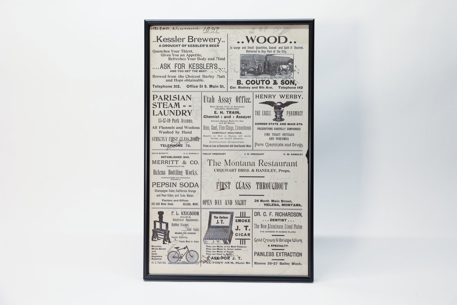 Framed Antique 1897 Helena Montana Newspaper Page: Ephemera. Featuring advertisements in the Helena Independent. Late 1800s. Handwritten notes. 11” x 17”Dimensions: H: 17", W: 11"
