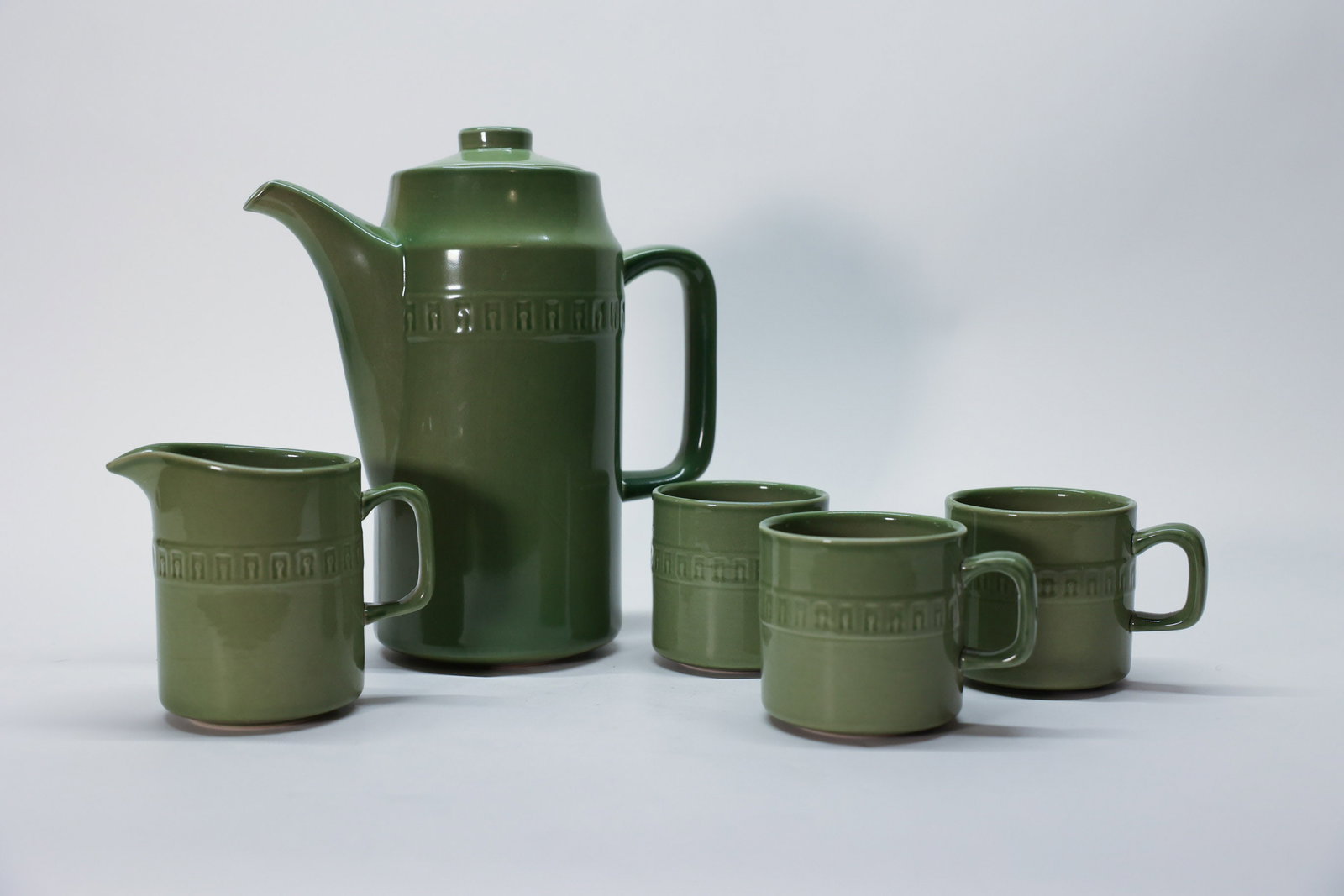 Vintage Stonecraft Seminole Coffee/Tea Pot Set: Avocado green stoneware. Includes pot, creamer, and three mugs.Dimensions: H: 9.5", W: 9", L: 9"