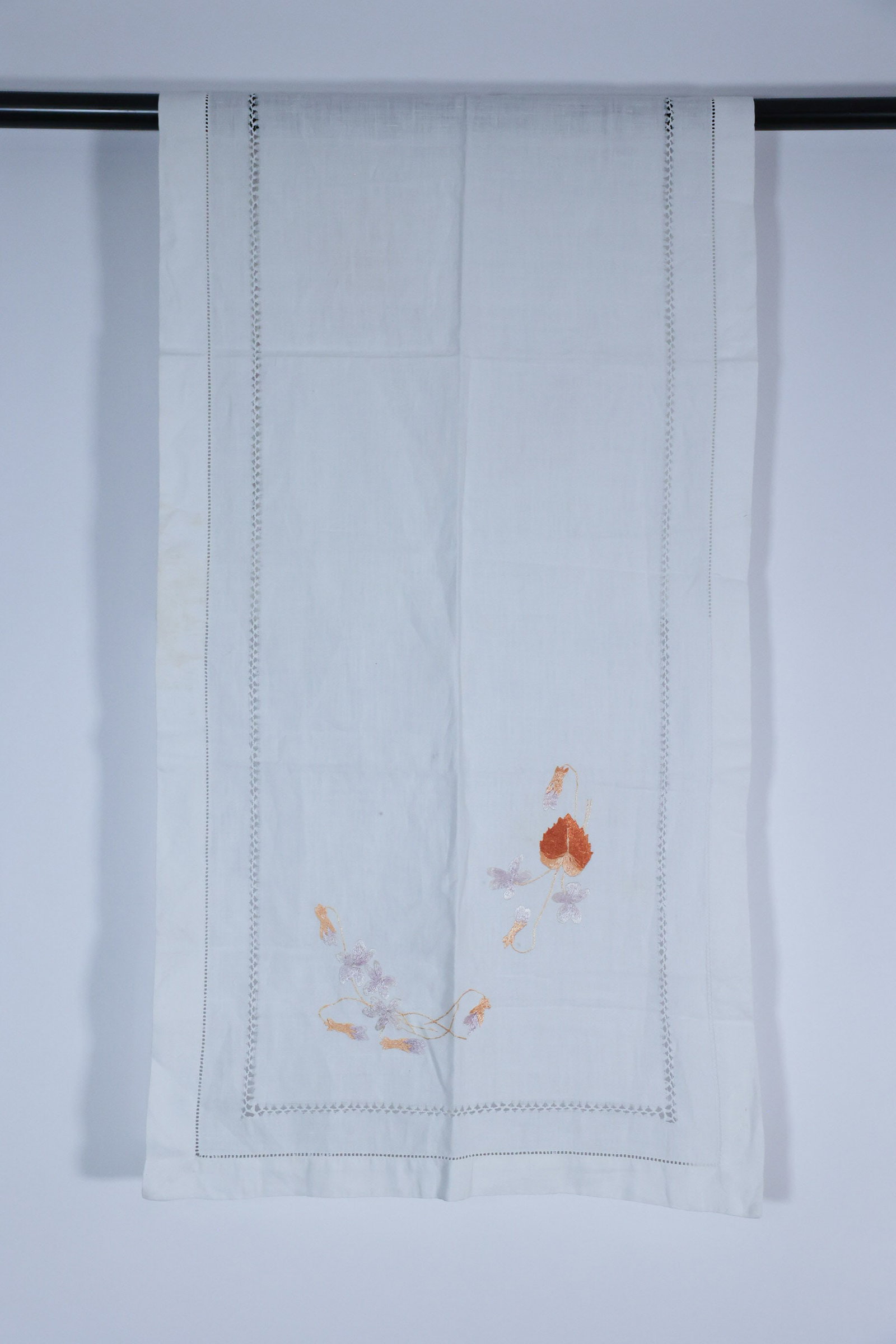 Vintage Hand Embroidered Table Scarf: A few holes. Hand embroidered flowers. Absolutely lovely. 17" x 46"Dimensions: H: 1", W: 3", L: 3"