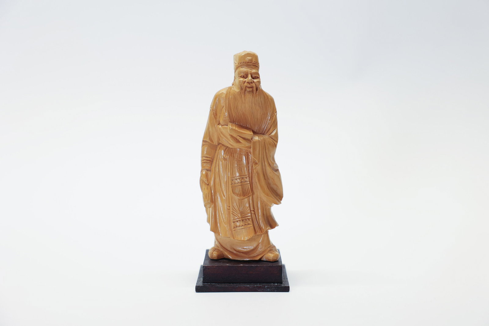 Vintage Chinese Carved Boxwood Figurine: Man with a book. Beautifully carved. 6 1/2" tall.Dimensions: H: 6.5", W: 3", L: 3"