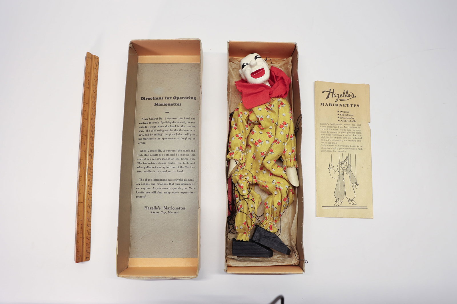 Vintage Hazelle's Clown Marionette in Box: A wonderful vintage Hazelle's Marionette clown puppet, complete with its original box, control bar, and printed instruction pamphlet. Made by Hazelle's Marionettes of Kansas City, Missouri, this joint