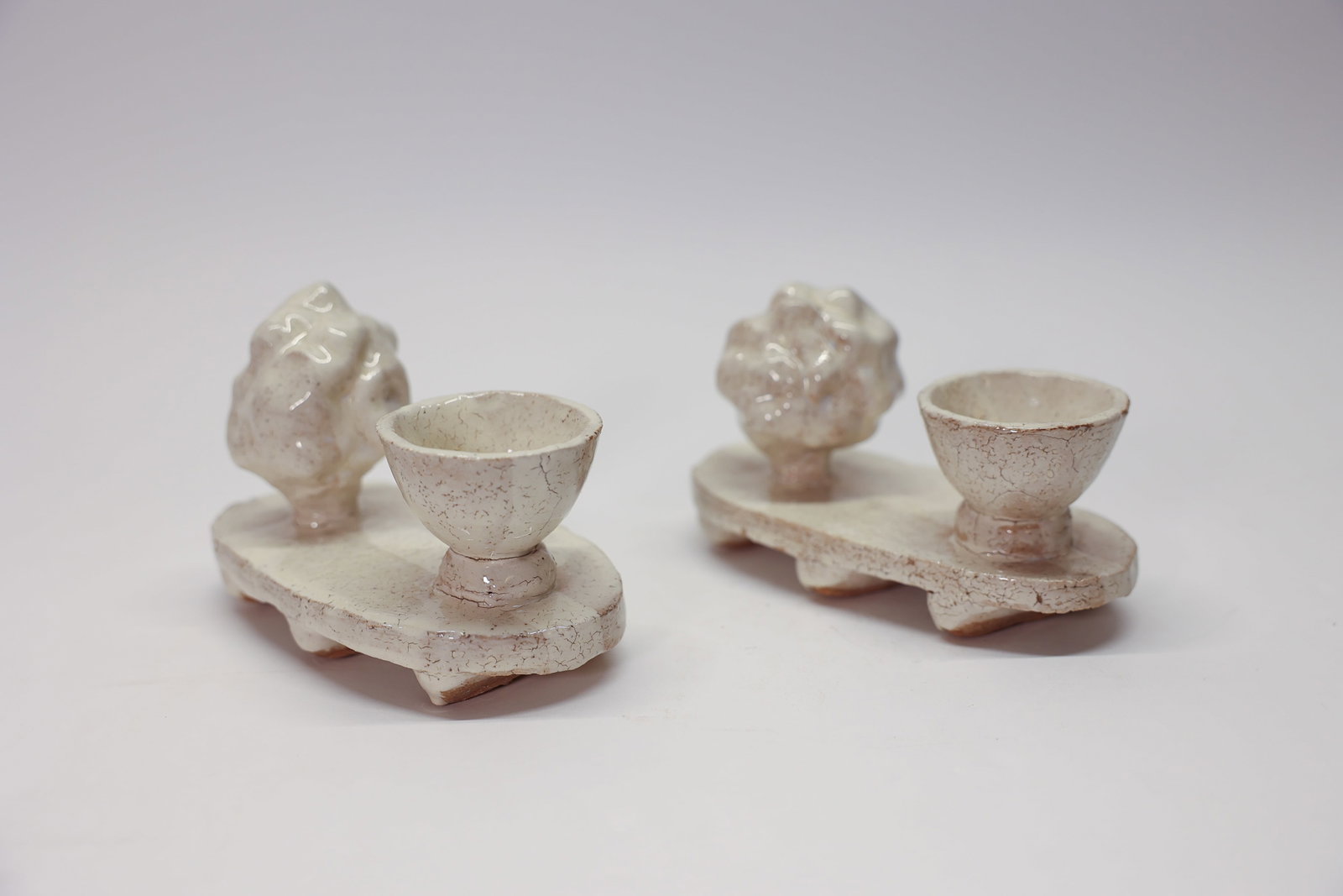 Pair of Studio Art Egg Cups or Perhaps Ink Wells: Pair Archie Bray Center egg cups (?) approx. 5.5" x 3" eachDimensions: H: 3", W: 6", L: 5.5"