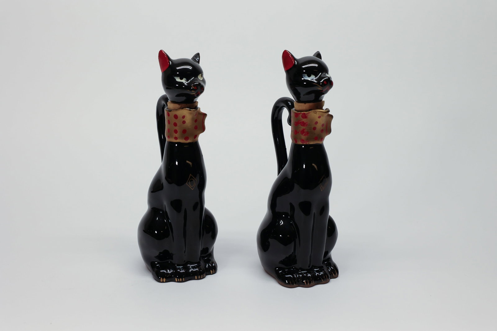 Relco Japan Black Cat Oil & Vinegar Cruet Set: Condition Report:Both cruets show the glossy black glaze intact with no chips or cracks noted to the ceramic body. Please examine all photos closely for any hairline cracks, glaze crazing, or wear to 