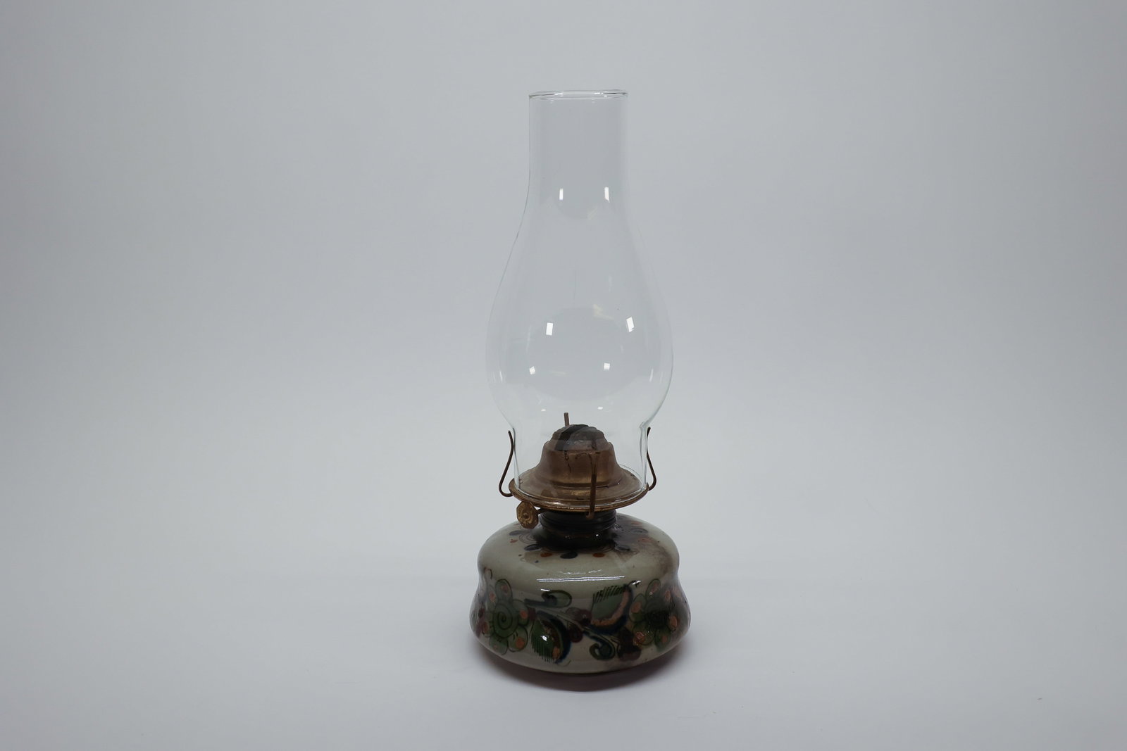 Tonalá Mexico Pottery Oil Lamp, Hand-Painted: Antique hand-painted pottery oil lamp from Tonalá, Jalisco, Mexico, a region renowned since pre-Hispanic times for its ceramic tradition, later blending indigenous techniques with Spanish colonial in
