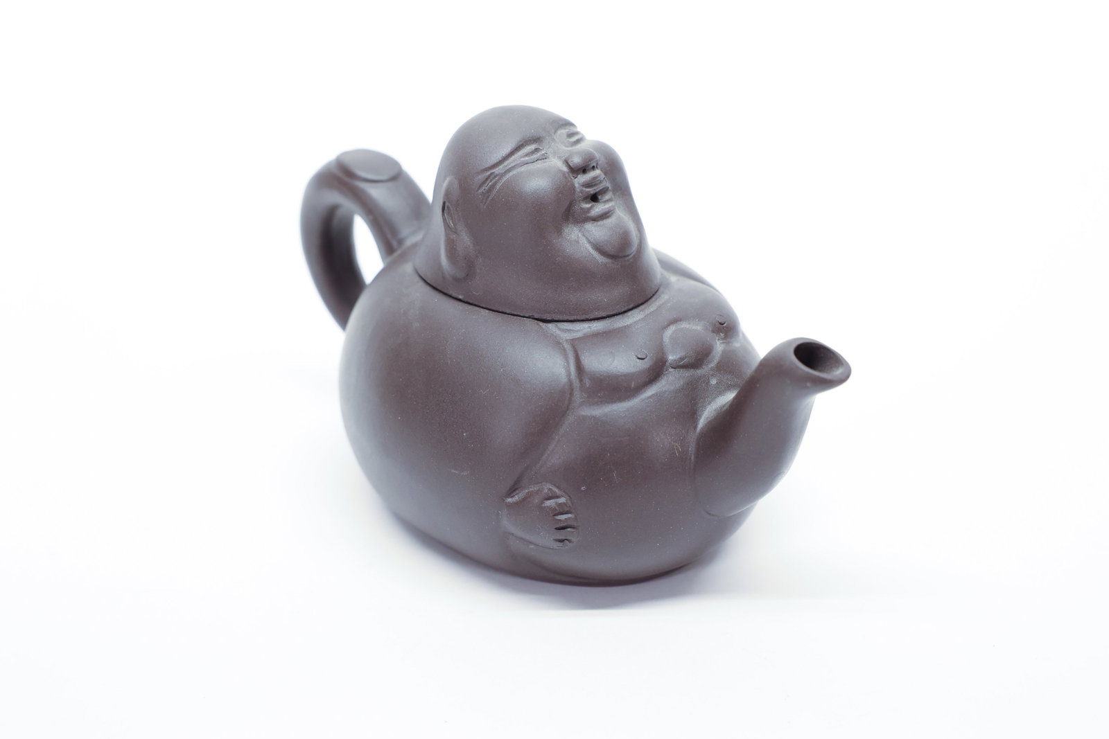 Chinese Yixing Zisha Laughing Buddha Teapot: Chinese Yixing-style zisha (purple clay) teapot modeled as a seated Budai, the "Laughing Buddha," his rotund belly forming the body of the pot, with a gently curved spout emerging from his side and a 