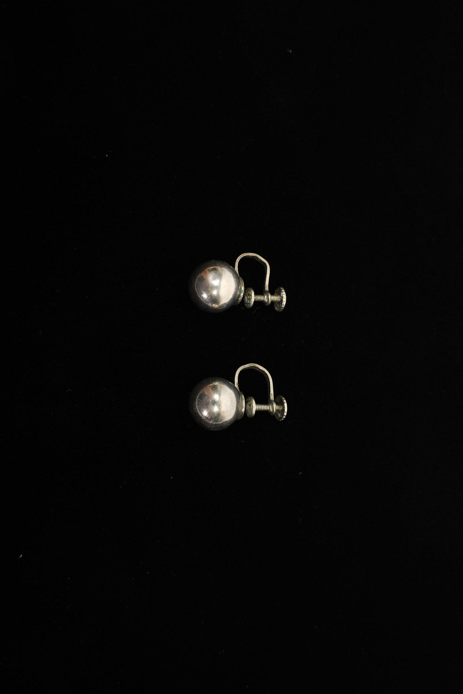 Vintage Sterling Silver Ball Screw-Back Earrings: A simple, classic pair of sterling silver ball earrings, each a smooth half-inch sphere in a bright, polished finish. These fasten with screw-back findings rather than posts, a fitting style that was 