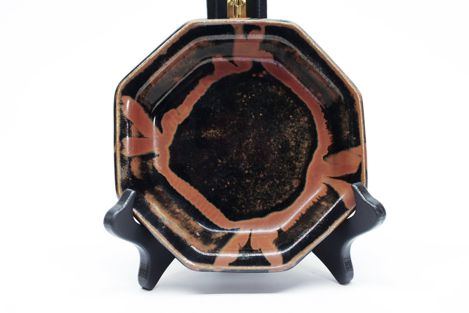 Studio Pottery Octagonal Dish, Drip Glaze: Confident gestural glaze application typical of mid-century studio pottery aesthetics, where potters favored bold, minimal decoration that let the glaze itself do the visual work. The unglazed