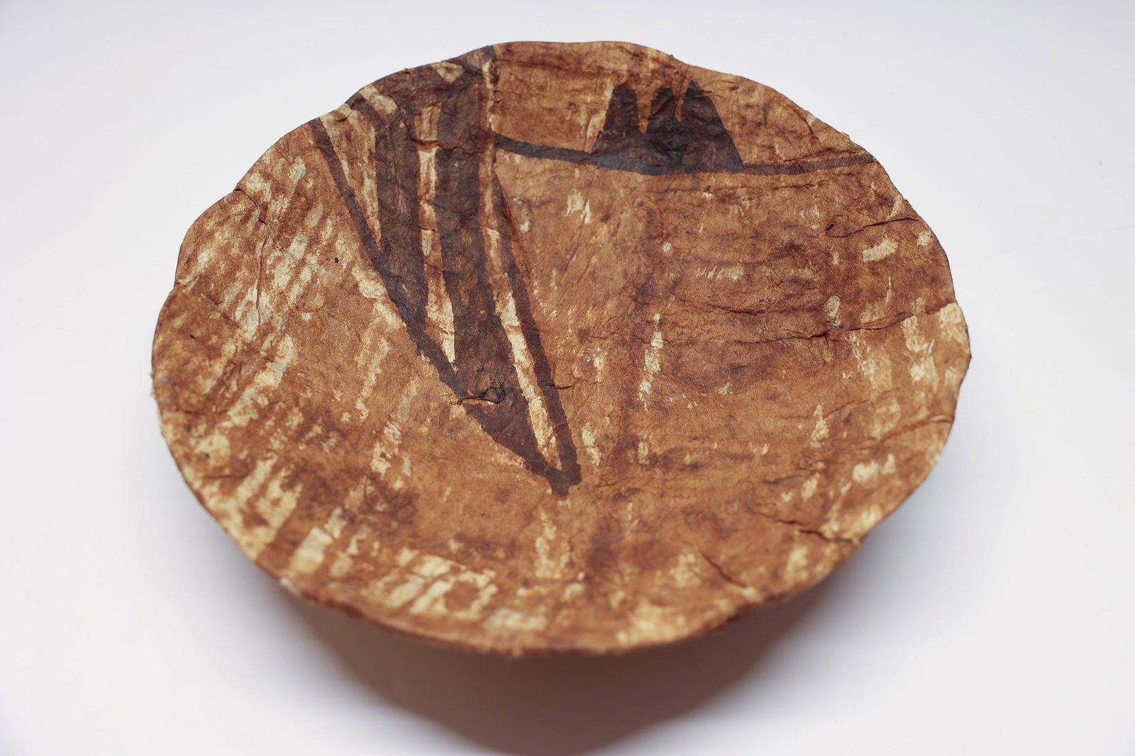 Papier-mâché Bowl: Interesting papier-mâché type bowl. Looks like handmade paper with some really lovely designs of triangles and dots on it. Kind of a neat piece. There is a wire armiture underneath. Diameter is 12
