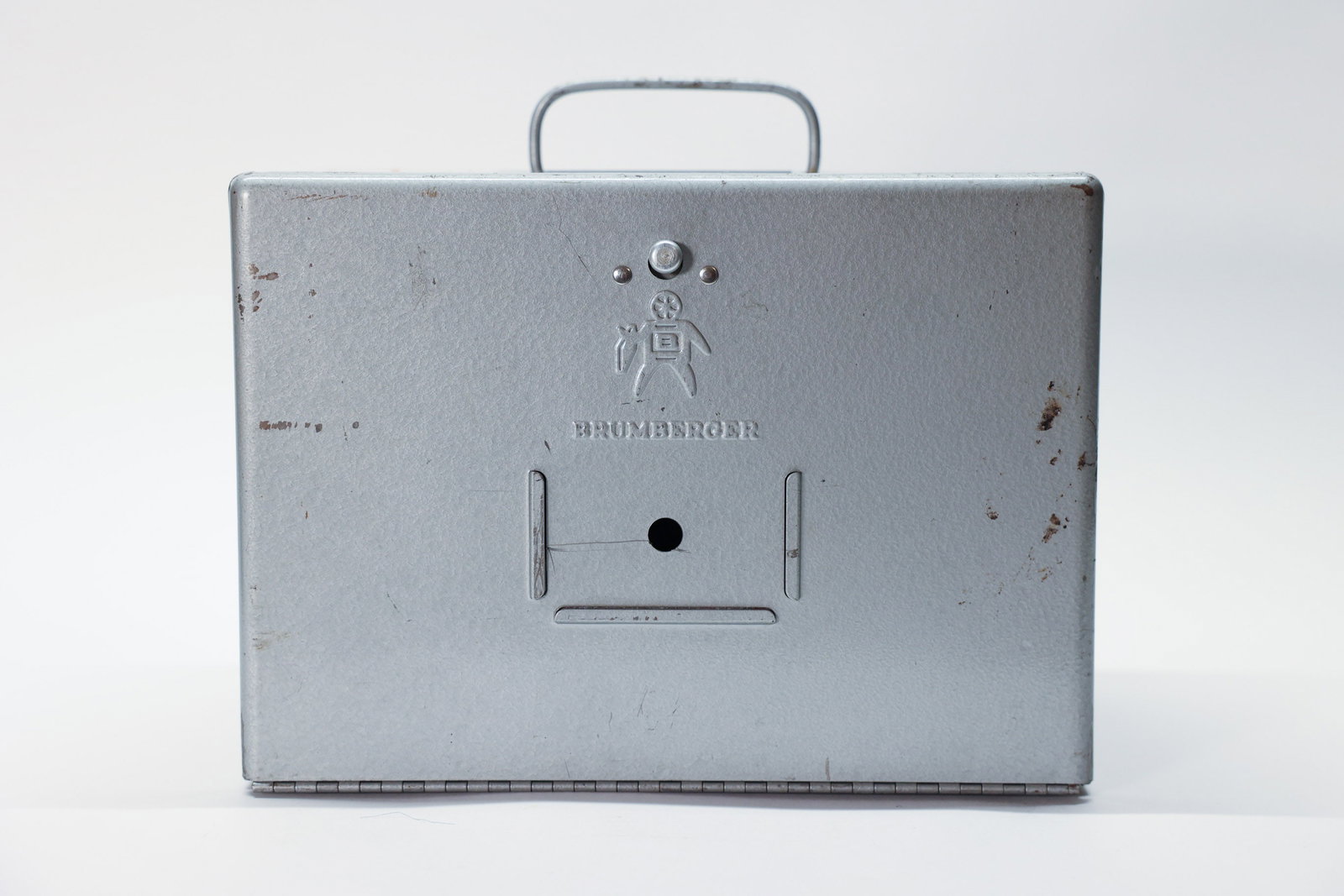 Brumberger #1009 Metal Reel Case: 8mm movie reel storage.Dimensions: H: 7.25", W: 10", L: 6.25"