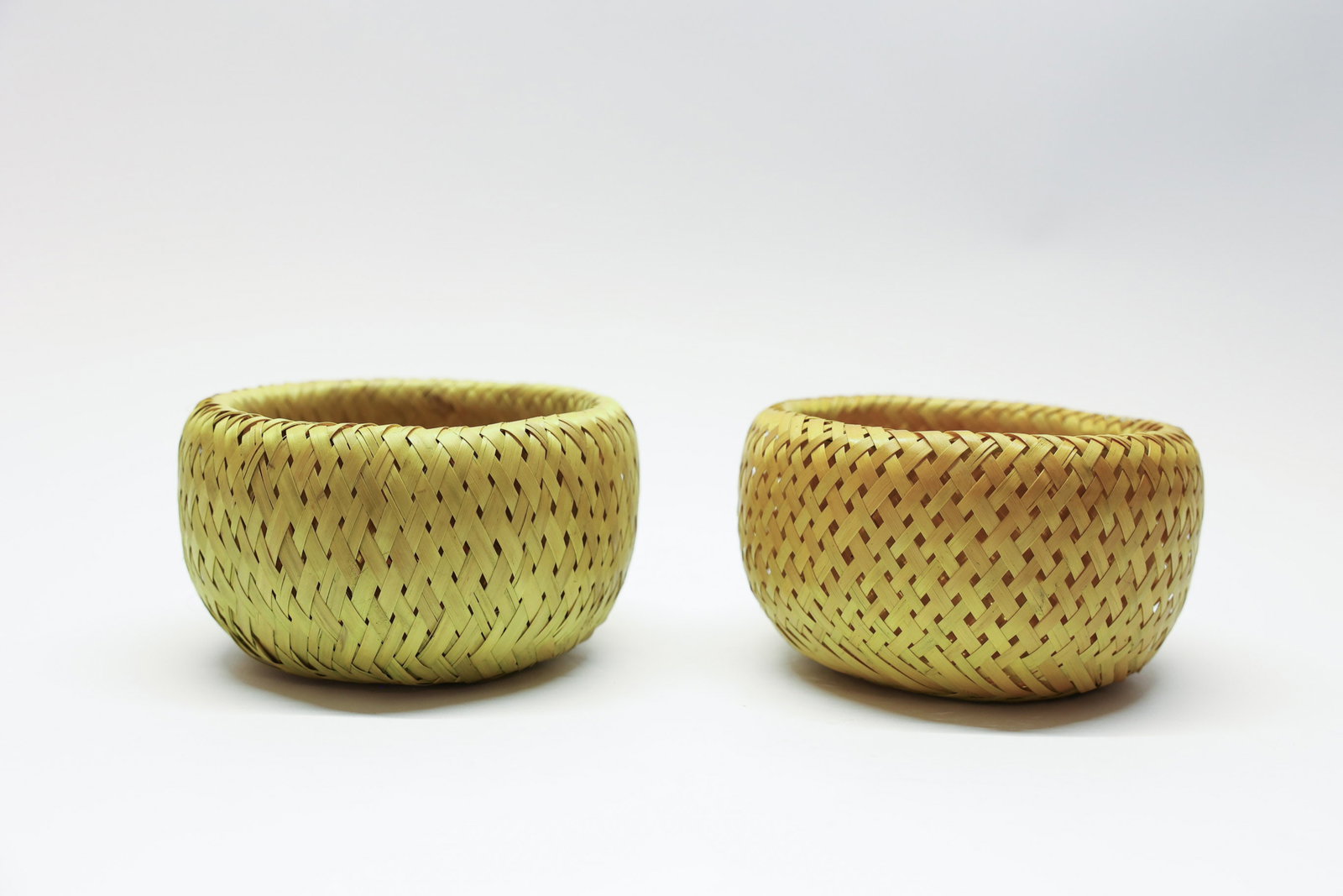 Crate & Barrel Bambu Woven Baskets, Pair: Crate and Barrel Bambu. Double wall construction. Neat.Dimensions: H: 6.5", W: 6.25"