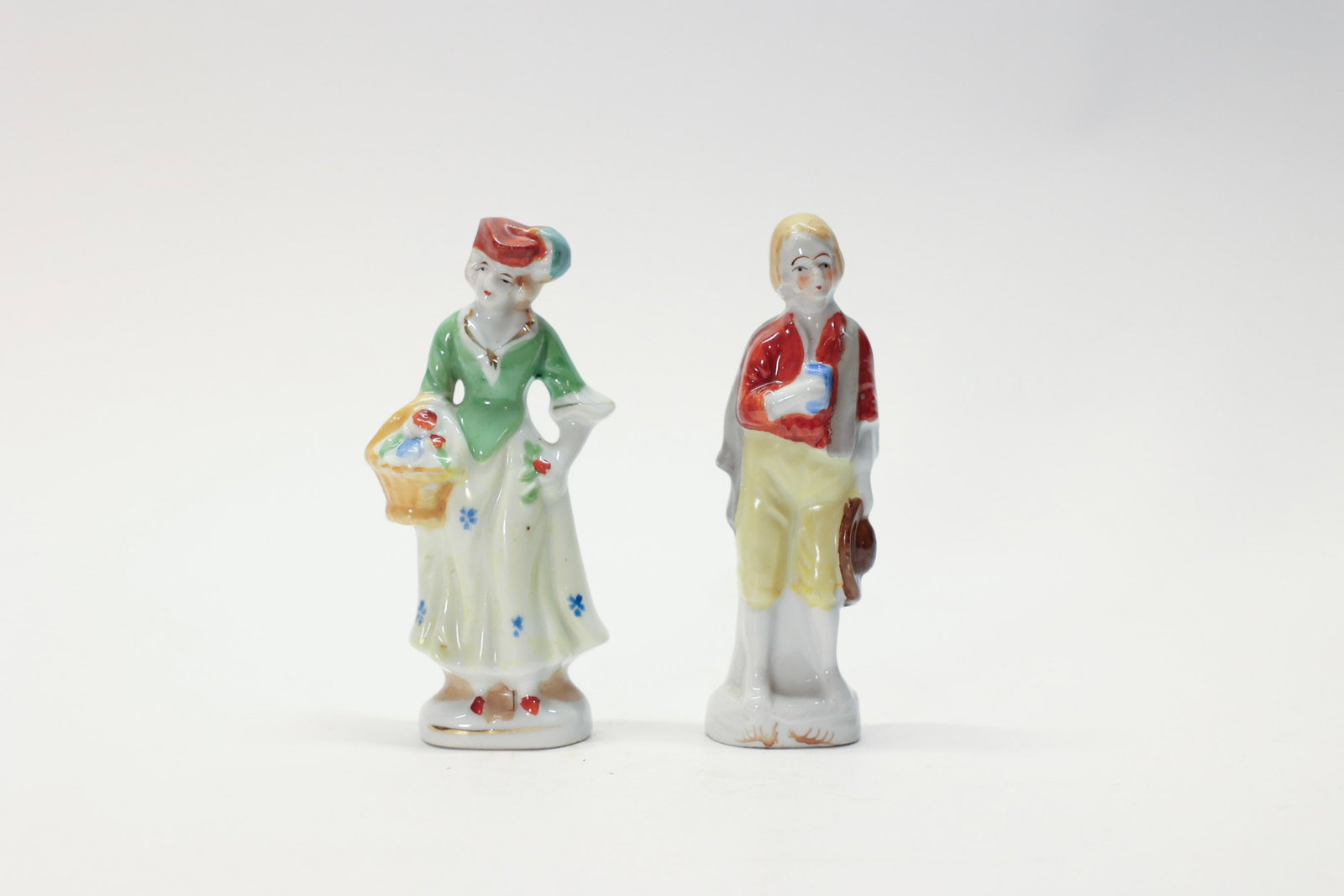 Pair Occupied Japan Porcelain Figurines: 5" tall.Dimensions: H: 5", W: 2", L: 2"