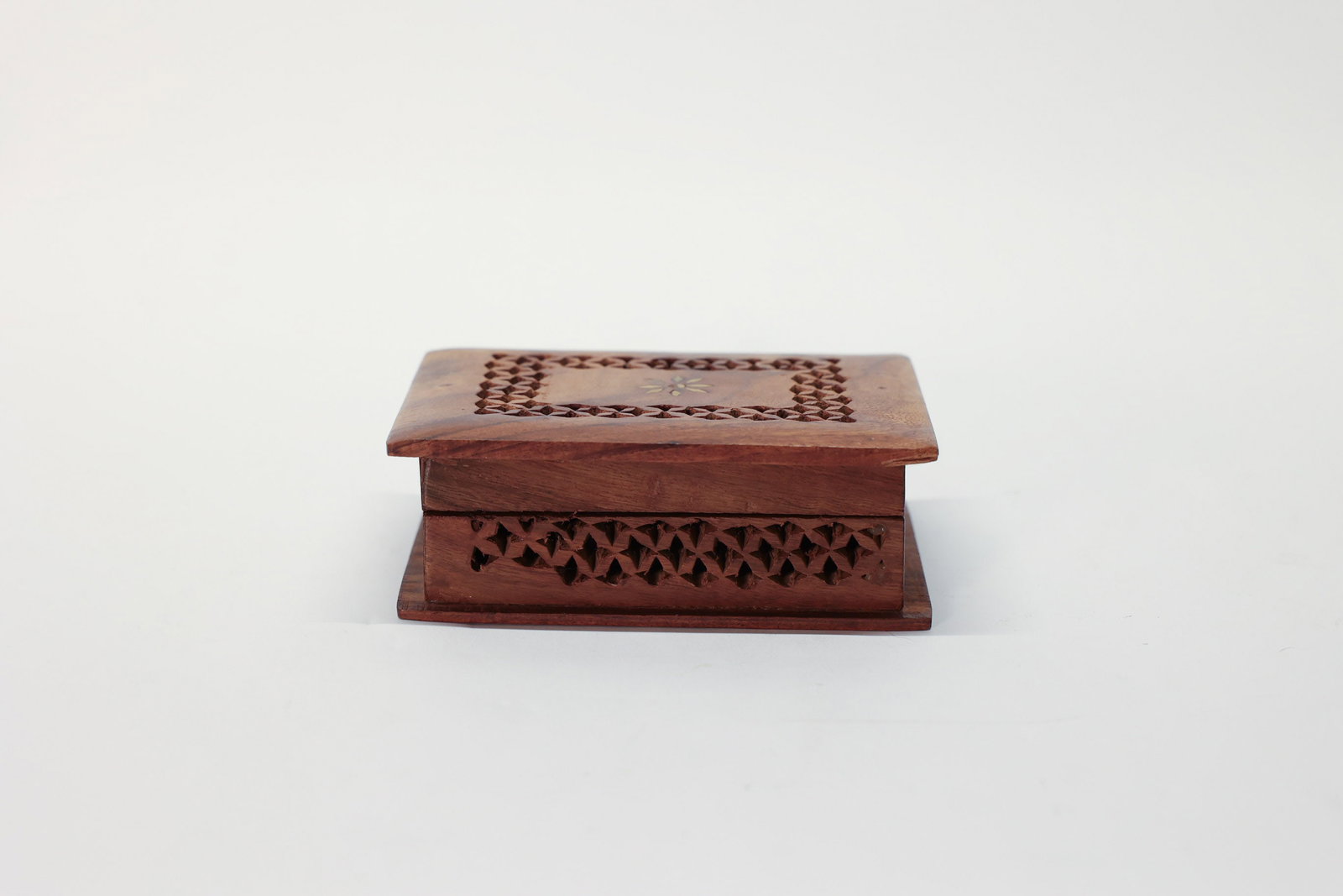 Handmade Wooden Box, Brass Floral Motif: Brass floral motif at the center. Intricate lattice cutwork. 5" long x 3 1/2" deep x 1 3/4" tall.Dimensions: H: 1.75", W: 3.5", L: 5"