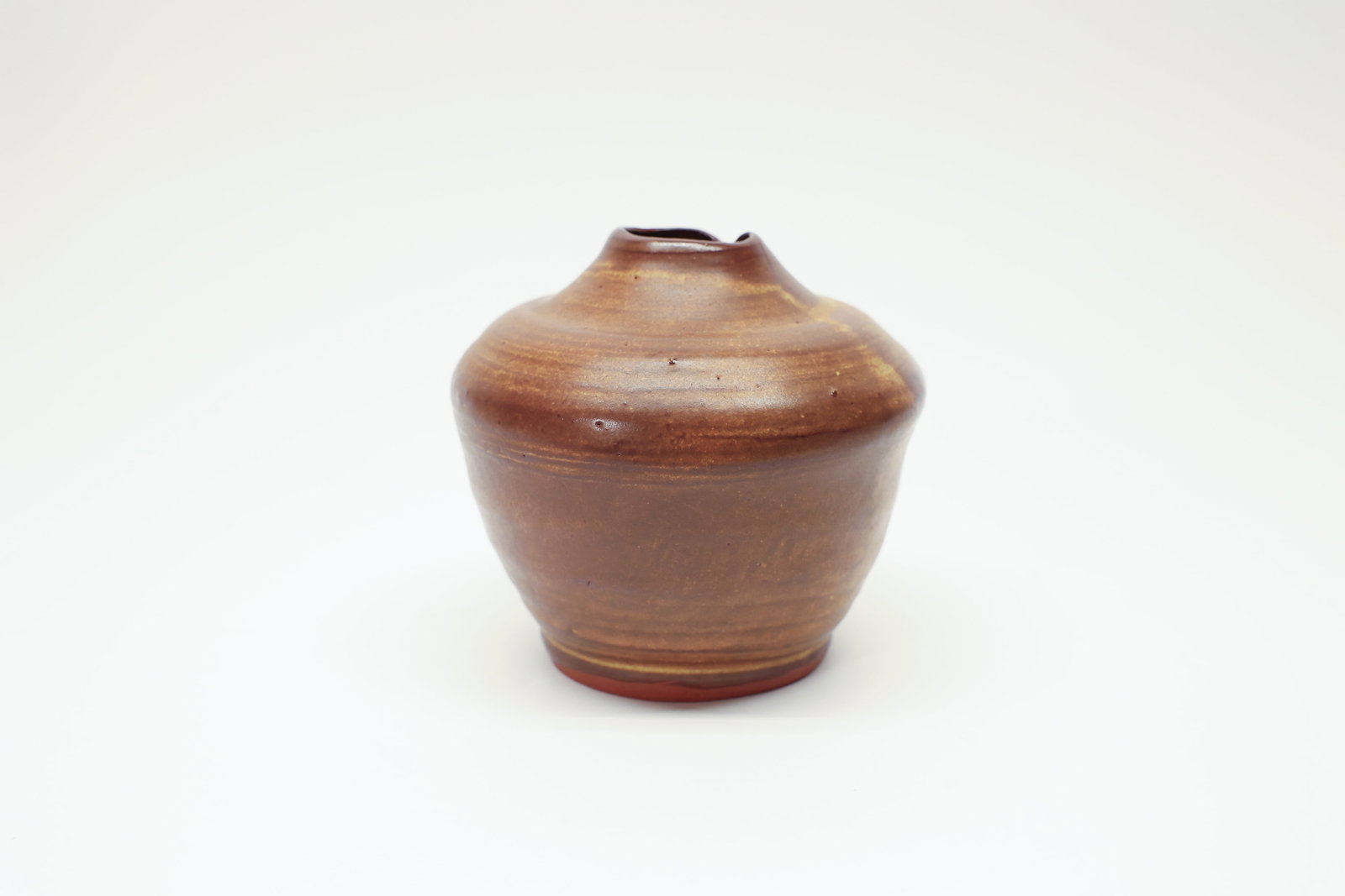 Studio Pottery Vase, Amber Glaze, Organic Rim: Beautiful hand-thrown studio pottery vase featuring a rich, glossy amber-brown glaze with subtle horizontal variation and golden striations throughout. The bulbous, rounded body tapers to a distinctiv